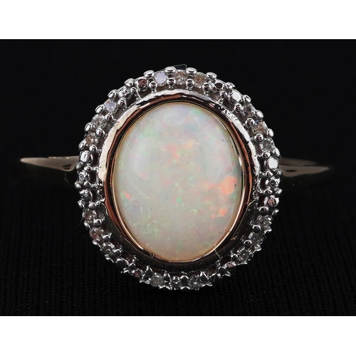 2083 - 9ct gold cabochon opal and diamond halo ring, size S, 1.8g