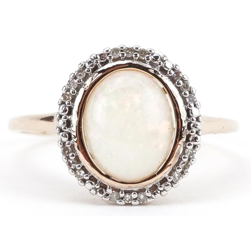 2083 - 9ct gold cabochon opal and diamond halo ring, size S, 1.8g