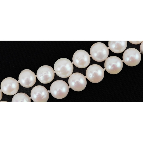 2113 - Single row cultured pearl necklace with silver clasp, each pearl approximately 9.5mm in diameter, ov... 