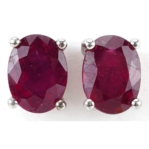 2202 - Pair of silver ruby stud earrings, each ruby approximately 8.10mm x 6.05mm x 3.50mm deep, 2.0g