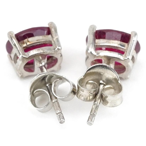 2202 - Pair of silver ruby stud earrings, each ruby approximately 8.10mm x 6.05mm x 3.50mm deep, 2.0g