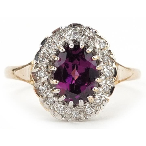 2242 - 9ct gold purple rhodolite garnet and diamond cluster ring, the garnet approximately 0.60 carat, tota... 