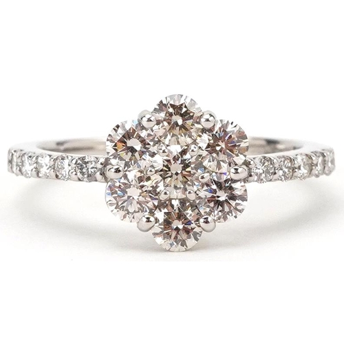 2290 - Platinum round brilliant cut diamond flower head ring with diamond set shoulders, total diamond weig... 