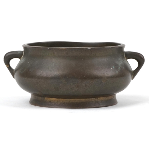 17 - Chinese patinated bronze censer with twin handles, six figure character marks to the base, 12cm wide