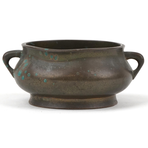 17 - Chinese patinated bronze censer with twin handles, six figure character marks to the base, 12cm wide