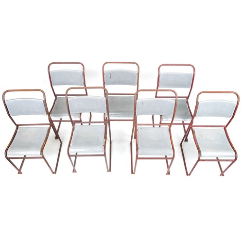 1103 - Thirteen industrial metal framed stacking chairs, each 85cm high