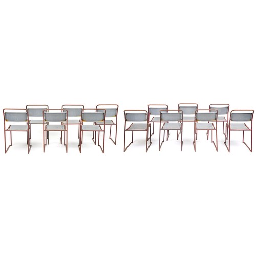 1103 - Thirteen industrial metal framed stacking chairs, each 85cm high