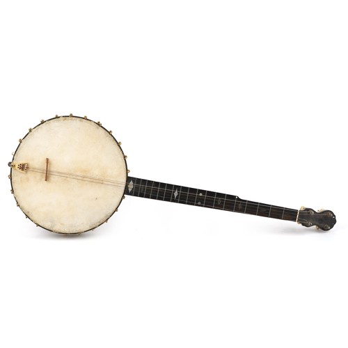 1206 - A C Fairbanks & Co mahogany and rosewood four string banjo with mother of pearl inlay, 88cm in lengt... 