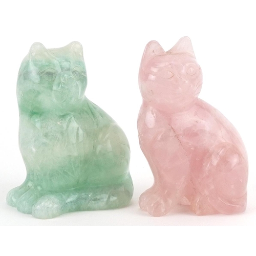 1324 - Two carved hardstone cats comprising rose quartz and fluorite, the largest 8.5cm high