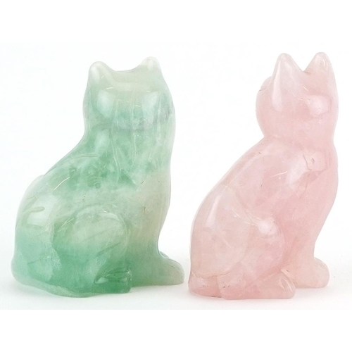 1324 - Two carved hardstone cats comprising rose quartz and fluorite, the largest 8.5cm high