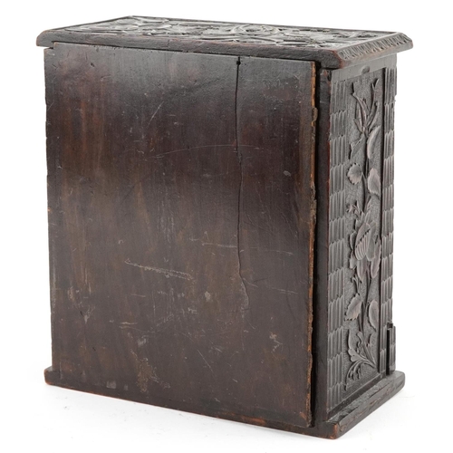 202 - 19th century oak table top collector's chest finely and profusely carved with foliage having hinged ... 