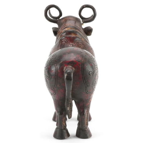 348 - Chinese partially gilt and red lacquered bronze  mythical animal, 22.5cm in length