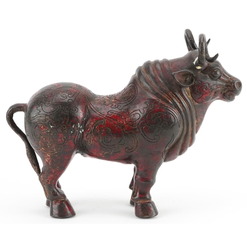 348 - Chinese partially gilt and red lacquered bronze  mythical animal, 22.5cm in length