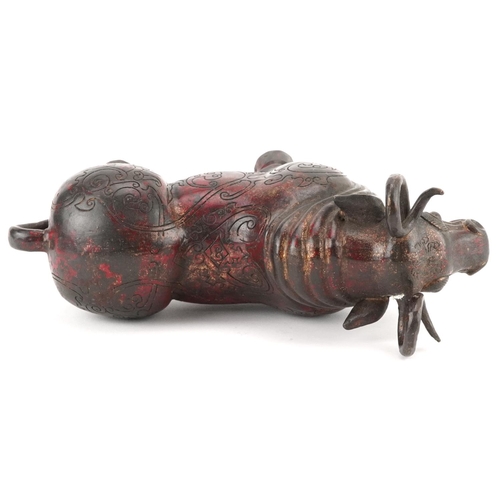 348 - Chinese partially gilt and red lacquered bronze  mythical animal, 22.5cm in length