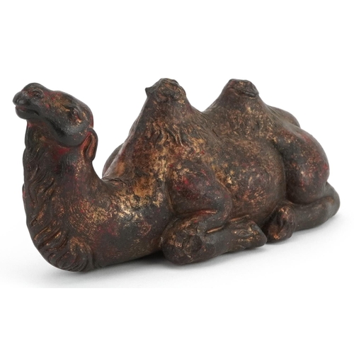 1571 - Chinese partially gilt and red lacquered bronze camel, 18cm in length