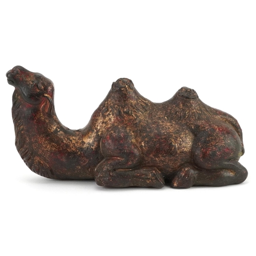 1571 - Chinese partially gilt and red lacquered bronze camel, 18cm in length