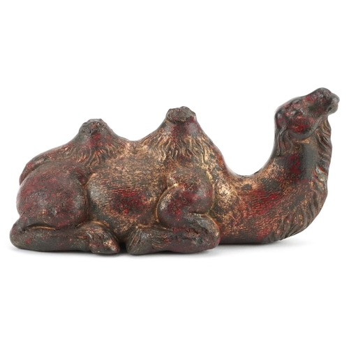 1571 - Chinese partially gilt and red lacquered bronze camel, 18cm in length