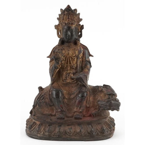 347 - Chino Tibetan gilt bronze figure of Buddha on mythical animal, 22.5cm high