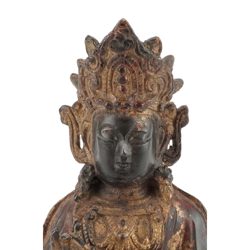 347 - Chino Tibetan gilt bronze figure of Buddha on mythical animal, 22.5cm high