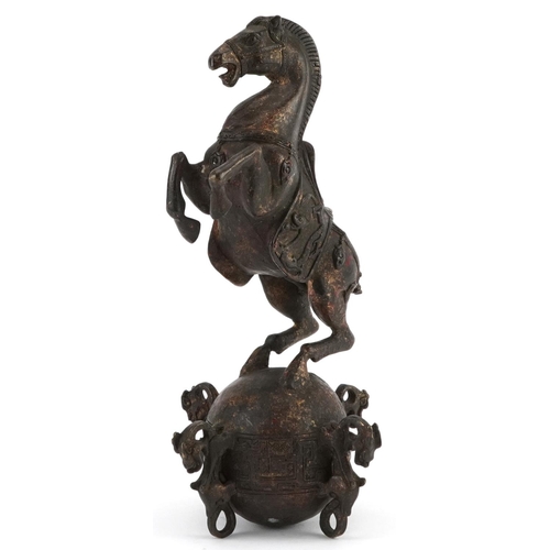 1320 - Chinese partially gilt and red lacquered bronze of a rearing horse, 22.5cm high