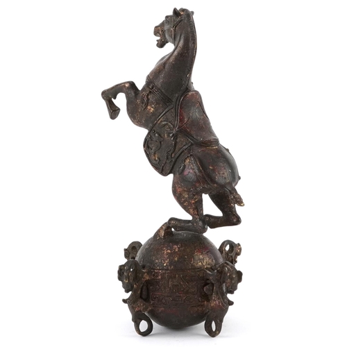 1320 - Chinese partially gilt and red lacquered bronze of a rearing horse, 22.5cm high