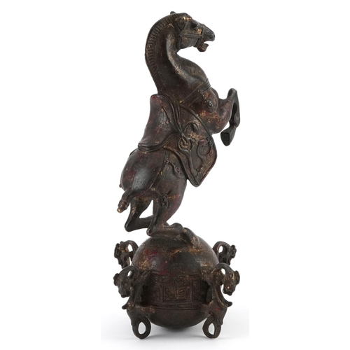 1320 - Chinese partially gilt and red lacquered bronze of a rearing horse, 22.5cm high