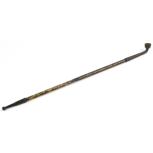 1515 - Chinese patinated bronze and metal opium pipe with foliate decoration, 48cm in length