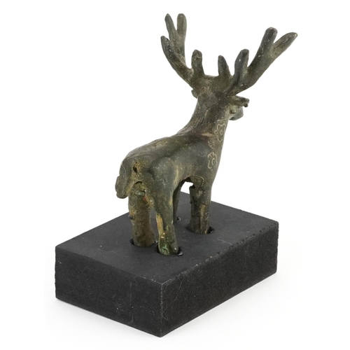 1530 - Middle Eastern Luristan type bronze of a deer raised on a rectangular black painted wooden base, ove... 