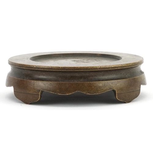 437 - Chinese patinated bronze four footed censer stand, 9.5cm in diameter