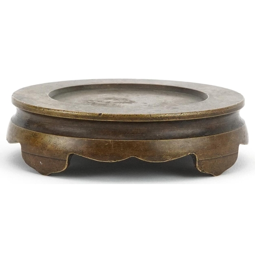 437 - Chinese patinated bronze four footed censer stand, 9.5cm in diameter