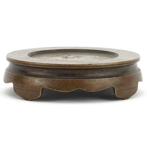 437 - Chinese patinated bronze four footed censer stand, 9.5cm in diameter