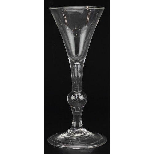 50 - 18th century wine glass on folded foot with knopped stem and enclosed bubble, 17cm high