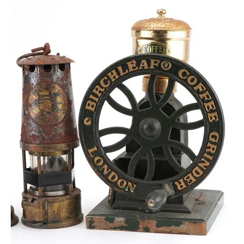 82 - Two early 20th century miner's lamps and a Birchleaf coffee grinder, the largest 31cm high