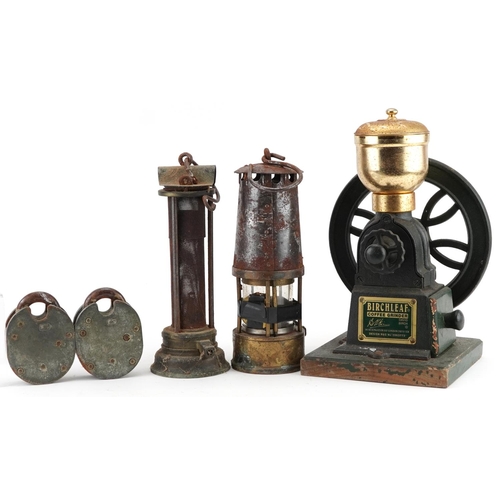 82 - Two early 20th century miner's lamps and a Birchleaf coffee grinder, the largest 31cm high