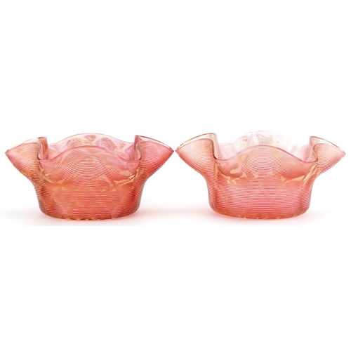 1334 - Pair of Art Nouveau iridescent peach glass finger bowls, each 14cm in diameter