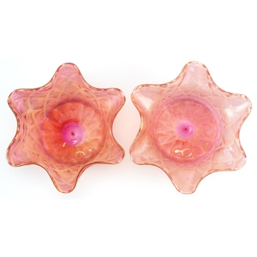 1334 - Pair of Art Nouveau iridescent peach glass finger bowls, each 14cm in diameter