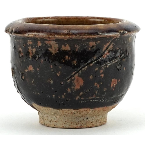 1538 - Japanese studio pottery Yunomi tea bowl having a purply brown glaze, 8.5cm in diameter