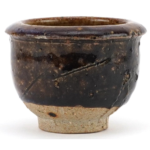 1538 - Japanese studio pottery Yunomi tea bowl having a purply brown glaze, 8.5cm in diameter