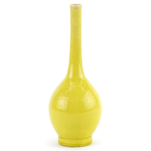 345 - Chinese porcelain long neck bottle vase having a yellow glaze, 19cm high