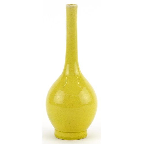 345 - Chinese porcelain long neck bottle vase having a yellow glaze, 19cm high