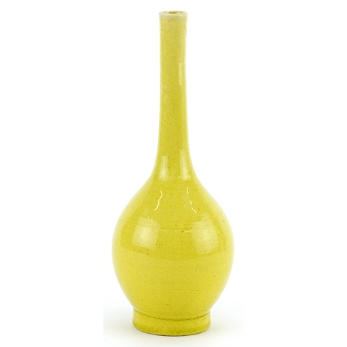 345 - Chinese porcelain long neck bottle vase having a yellow glaze, 19cm high