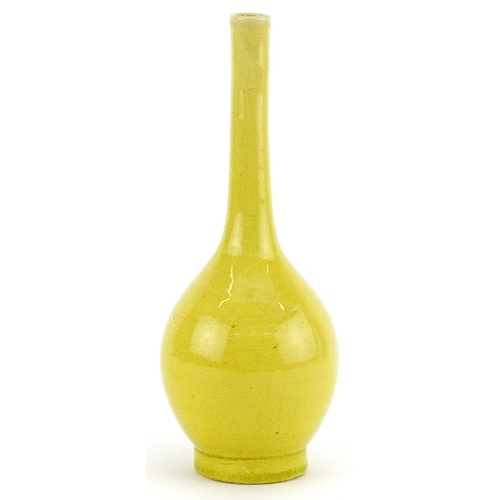 345 - Chinese porcelain long neck bottle vase having a yellow glaze, 19cm high