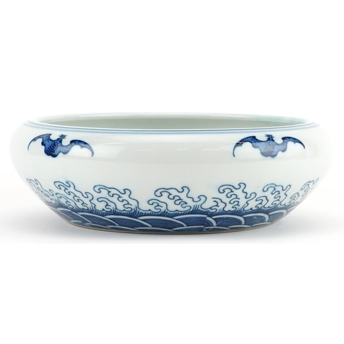 1335 - Chinese blue and white porcelain bowl decorated with bats above crashing waves, six figure character... 