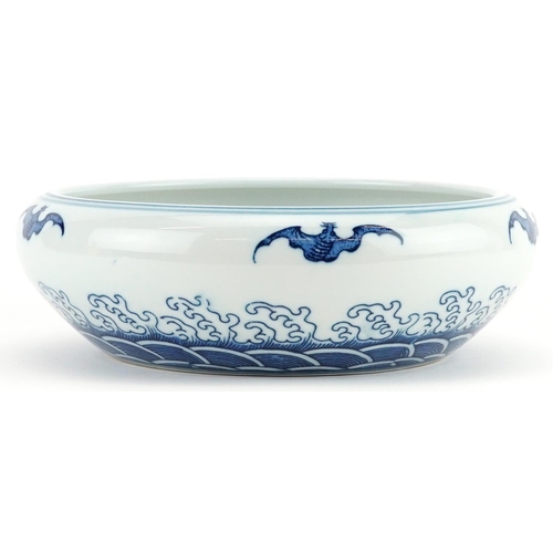 1335 - Chinese blue and white porcelain bowl decorated with bats above crashing waves, six figure character... 