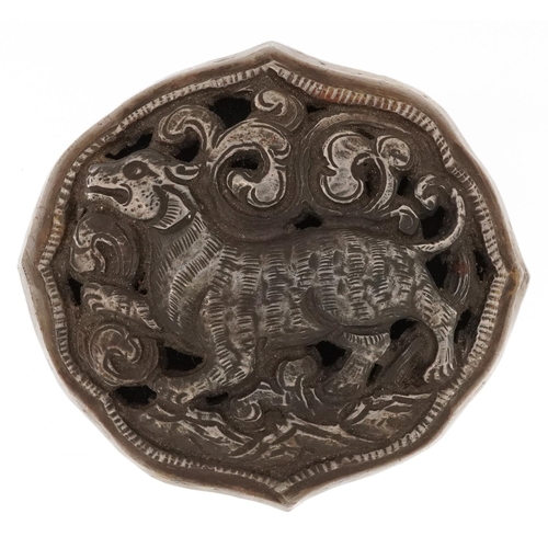 1252 - Indo Persian white metal buckle cast and pierced with a mythical animal amongst clouds, 8.5cm wide