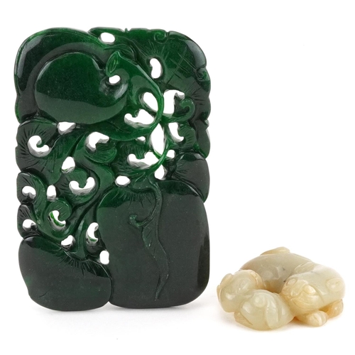 560 - Two jade carvings including a green panel carved with fruit, the largest 11cm x 7.5cm