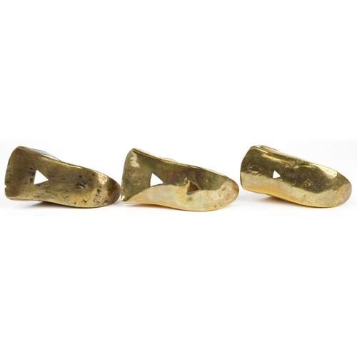 490 - Three 19th century Spanish Conquistador brass stirrups with foliate decoration including a pair, eac... 