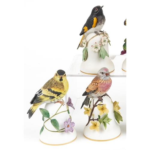 694 - Peter Barrett for Franklin Porcelain, eight hand painted porcelain bird table bells including The En... 