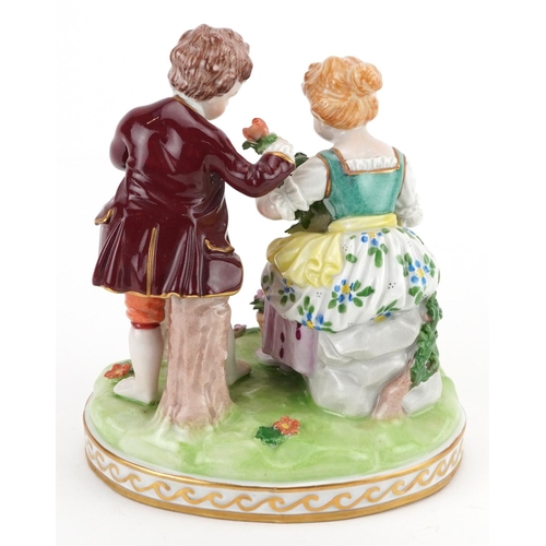 418 - Dresden, German porcelain comprising a summer figure group of a young boy and girl holding flowers f... 