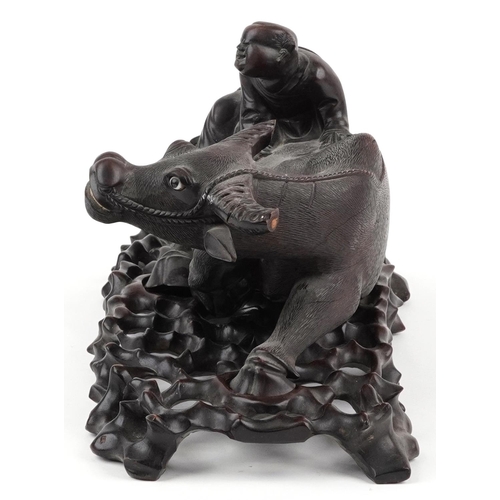 563 - Large Chinese hardwood carving on stand of a boy on buffalo, 41.5cm in length